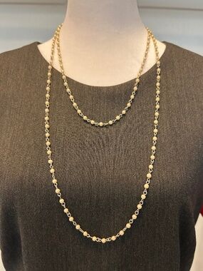 Long gold toned beaded necklace